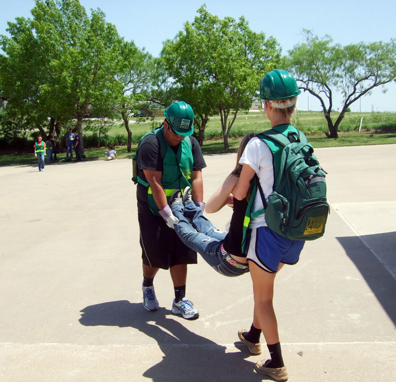Photo of teens performing training duties